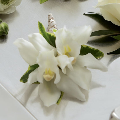 White Mini Cymbidium Boutonniere –  Reema Floral, Nolensville TN